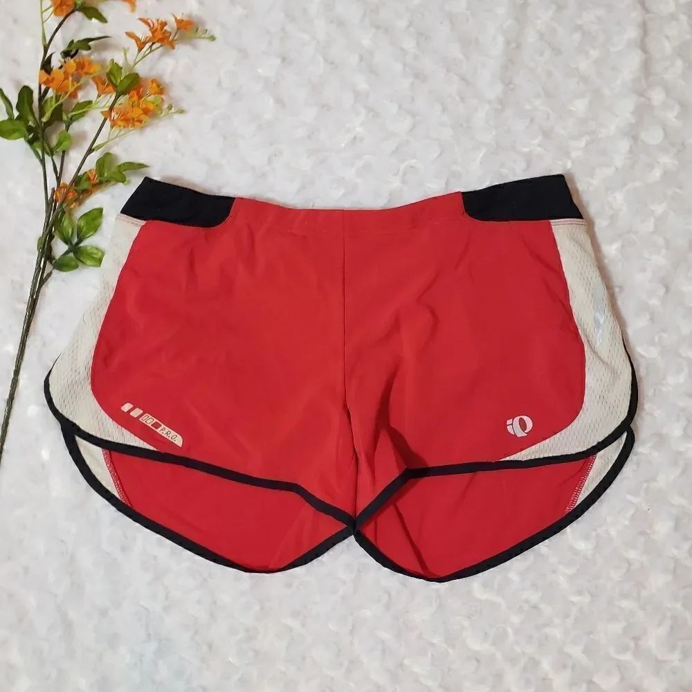 Pearl Izumi medium red black and white running shorts with zippered pocket